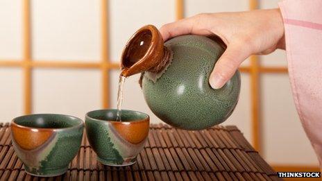 Woman pouring sake