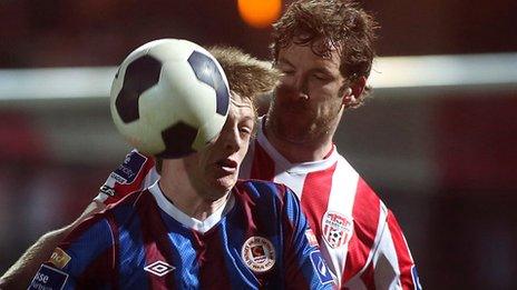 Chris Forrester of St Pat's Athletic in action against Ryan McBride of Derry City