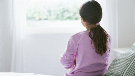 Child looking out of window