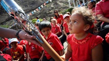 Primary school pupil with the Queen's baton in St Helena