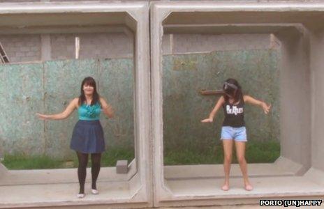 Girls dancing by construction works