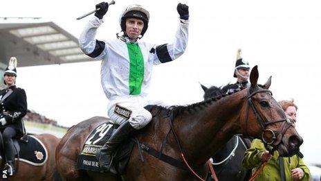 Winning jockey Leighton Aspell celebrates on Pineau De Re