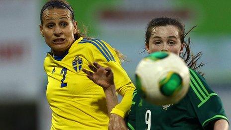 Sweden's Charlotte Rohlin and Aimee Mackin tussle for possession