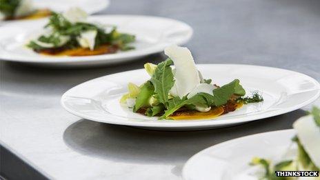 Four plates of salad