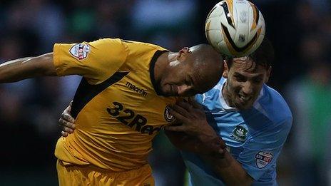 Plymouth's Maxime Blanchard and Newport's Chris Zebroski compete for the ball