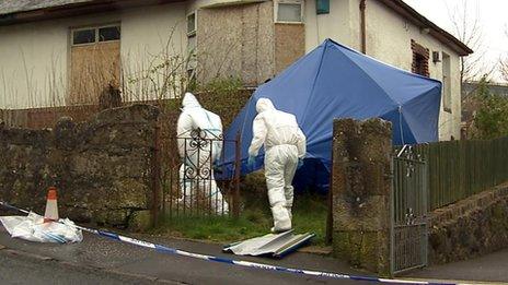 Forensic experts at the property in Largs