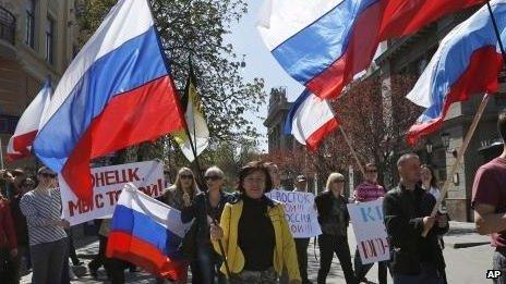 Demonstrators carry Russian flags in support of pro-Russian protesters in eastern Ukraine, in Simferopol, Crimea