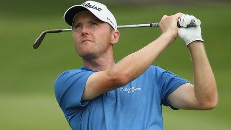 Michael Hoey watches his shot in the second round at the Malaysian Open