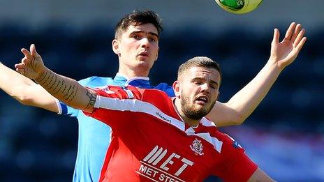 Jimmy Callacher of Linfield in action against Portadown's Darren Murray