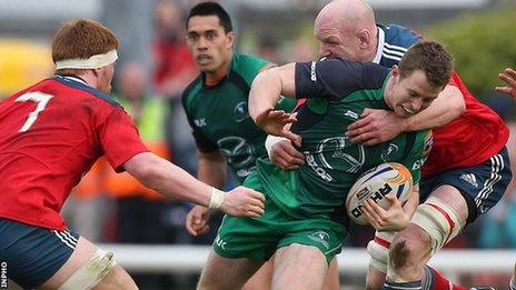 Connacht's Matt Healy is tackled by Munster lock Paul O'Connell