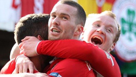 Cliftonville players celebrate a goal