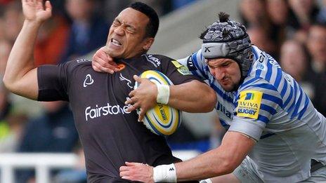 Newcastle's Sinoti Sinoti is high tackled by Saracens' Eoin Sheriff