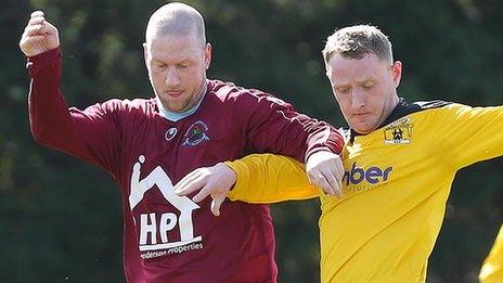 Institute's Stephen O'Flynn tussles with H&W Welders player Craig Harris