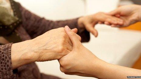 Elderly woman with carer