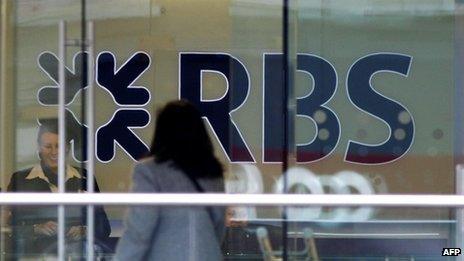 A customer walks into a branch of the Royal Bank of Scotland building