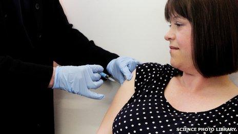 Pregnant woman being given whooping cough vaccine