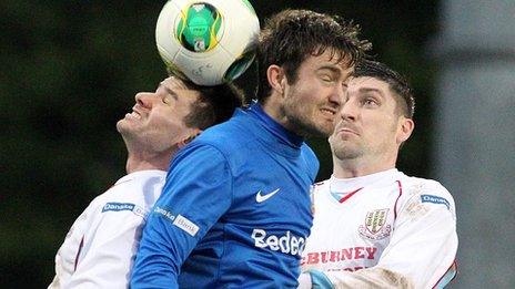 Ballymena's Mark McCullagh and Mark Patton of Glenavon contest a high ball