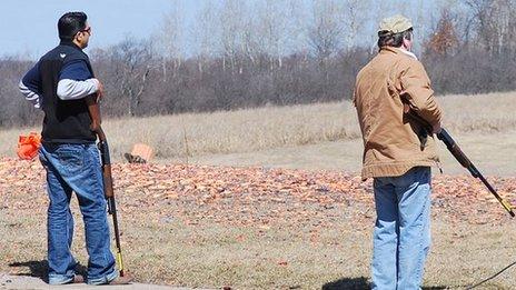 Amar Kaleka and another man at a shooting range