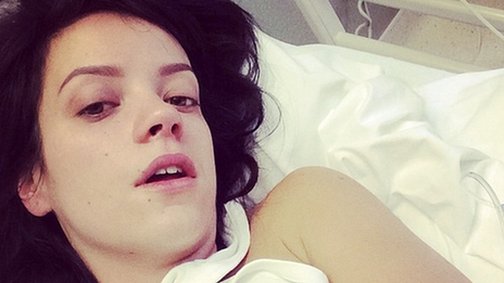 Lily Allen in a hospital bed with a drip