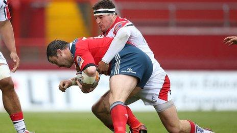 Damien Varley is tackled by Rob Herring