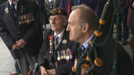 D-Day pipes with veteran soldiers