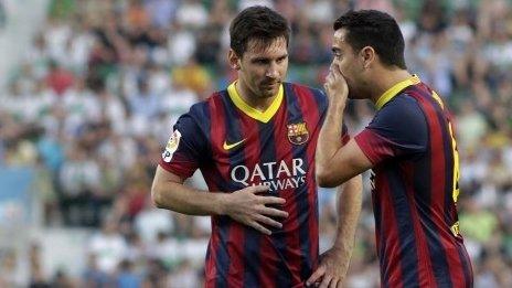 Lionel Messi and Xavi