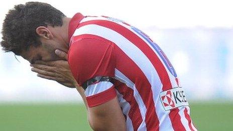 Atletico Madrid's Koke reacts following a missed chance against Malaga