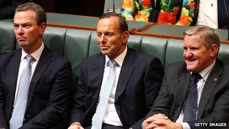 Australian Prime Minister Tony Abbott listening to the budget being delivered