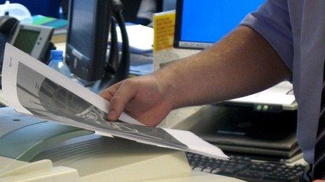 Man photocopying documents