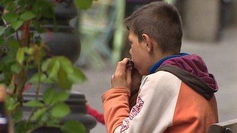 Boy playing harmonica