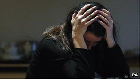 Woman with her head in her hands (picture posed by model)