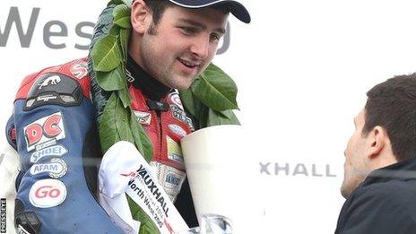 Michael Dunlop collects his trophy after the Superstock victory