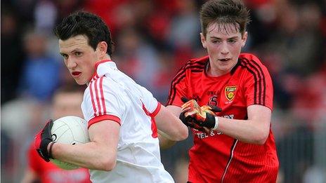 Tyrone's Ronan Nugent in action against Frank Aiken of Down