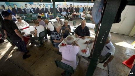 Men play dominos in Miami's Little Havana neighbourhood