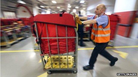 Man pushing sorted parcels