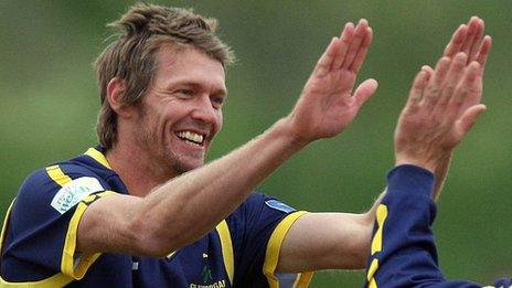 Michael Hogan celebrates taking a wicket for Glamorgan