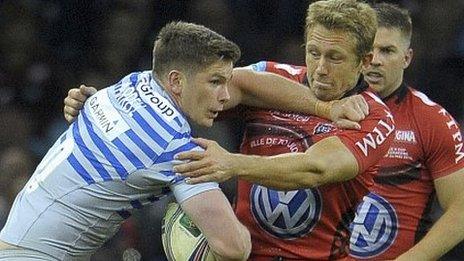 Saracens' Owen Farrell tries to make headway against Jonny Wilkinson