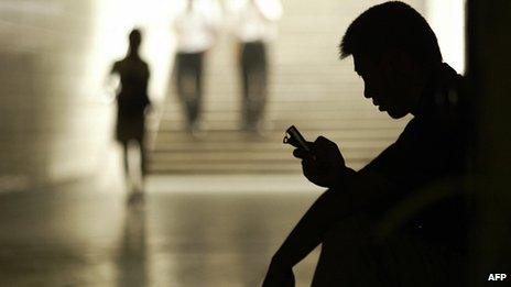 A man using mobile phone in China