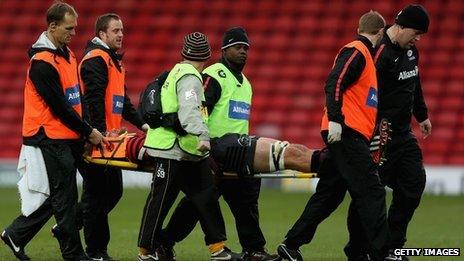 Alistair Hargreaves of Saracens leaves the pitch concussed a second time during the Aviva Premiership match between Saracens and London Wasps