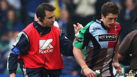 Tom Williams of Harlequins walks off the pitch as blood pours from his mouth during the Heineken Cup Quarter Final v Leinster in 2009