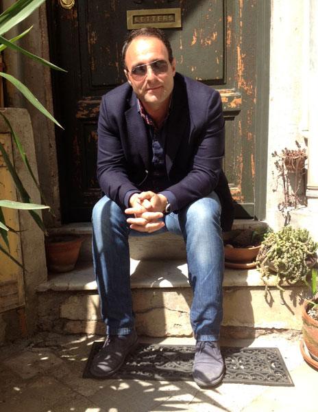 Luigi Di Cicco sitting on a step