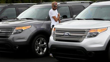 Man looking at Ford explorer