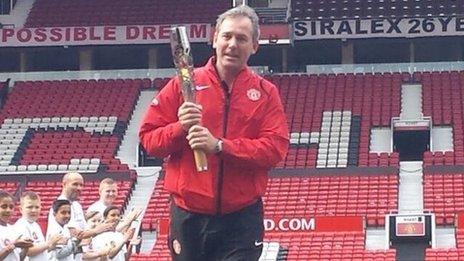 Bryan Robson with the baton at Old Trafford