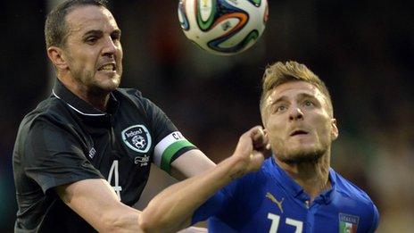 Republic of Ireland defender John O'Shea competes against Ciro Immobile of Italy