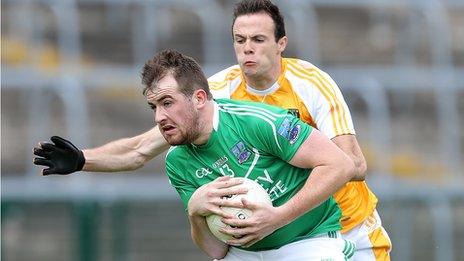 Fermanagh's Sean Quigley with Antrim's Ricky Johnston