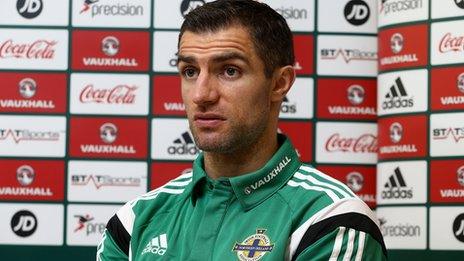 Aaron Hughes hopes to resolve his future after international duty