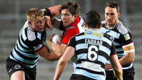 St Helens' Louie McCarthy-Scarsbrook is tackled by London Broncos' James Greenwood