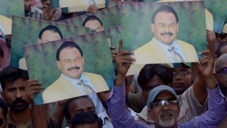 MQM supporters in Karachi hold pictures of Altaf Hussain (3 June 2014)