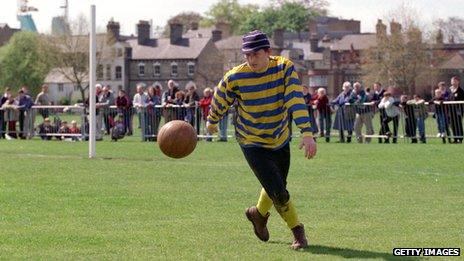 Cambridge University player in action during the Town and Gown match between Cambridge University and Zion Eagles F at Parker's Piece, Cambridge