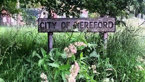 Overgrown City of Hereford sign